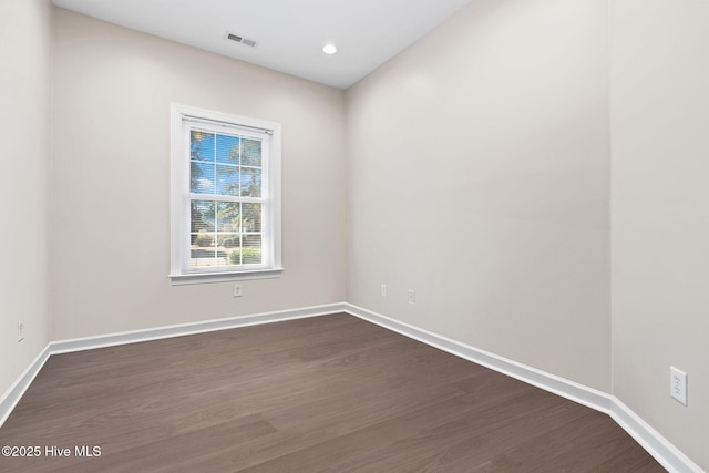 4379 Gauntlet Dr, Southport, NC 28461 - spare room featuring dark wood finished floors, baseboards, and recessed lighting