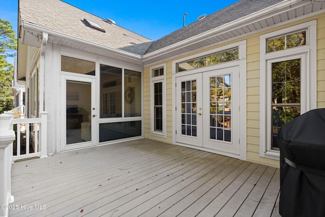 4379 Gauntlet Dr, Southport, NC 28461 - wooden terrace with area for grilling and french doors