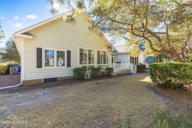 4379 Gauntlet Dr, Southport, NC 28461 - rear view of house with central AC unit, a deck, and crawl space
