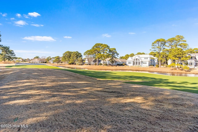 4379 Gauntlet Dr, Southport, NC 28461 - view of grassy yard featuring a residential view and a water view
