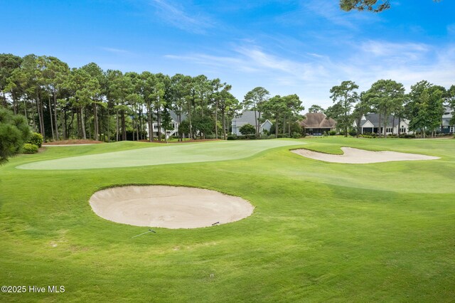 4379 Gauntlet Dr, Southport, NC 28461 - surrounding community featuring a lawn, view of golf course, and a residential view