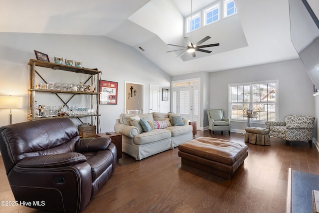 living room featuring dark wood-type flooring, ceiling fan, and vaulted ceiling