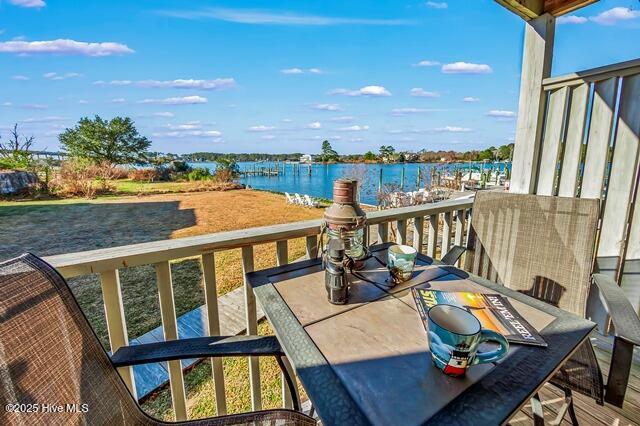 balcony featuring a water view