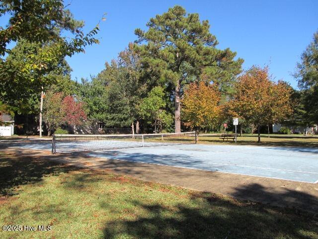 surrounding community with tennis court