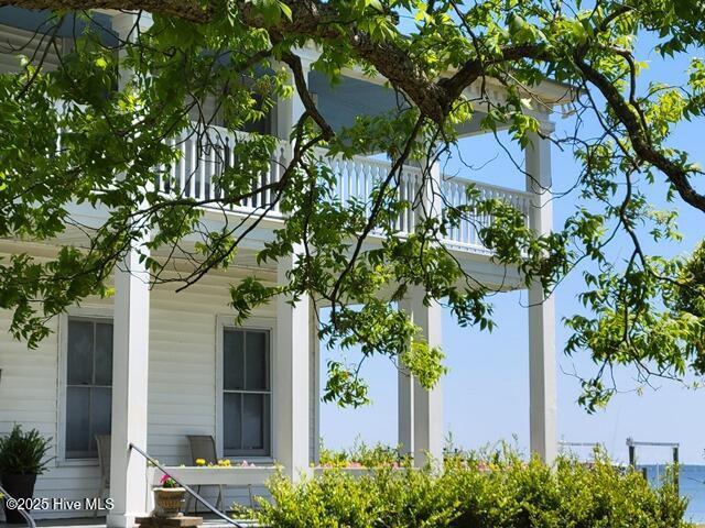 view of side of property with a balcony