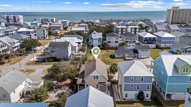 drone / aerial view featuring a water view and a residential view