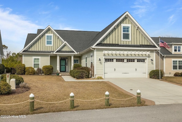 craftsman house featuring board and batten siding, concrete driveway, an attached garage, and a shingled roof