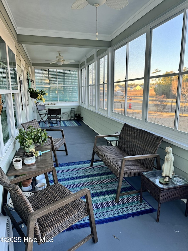 sunroom with ceiling fan