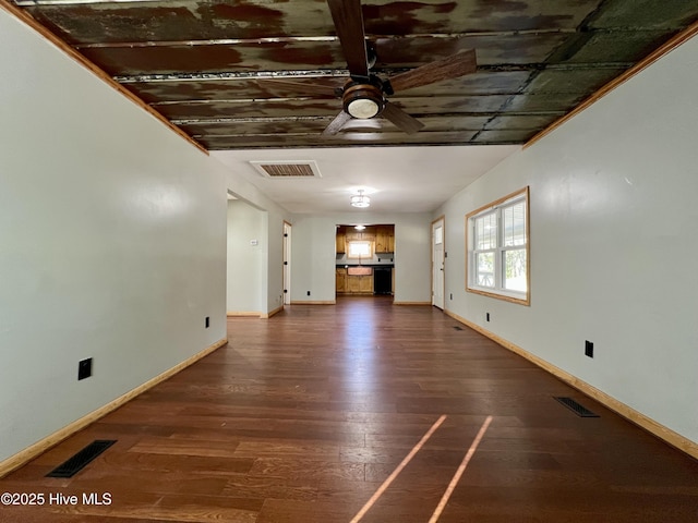 unfurnished living room with dark hardwood / wood-style floors and ceiling fan