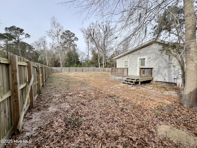 view of yard featuring a wooden deck