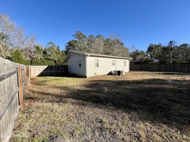 exterior space featuring a lawn and cooling unit