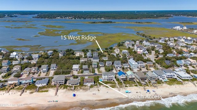 bird's eye view with a view of the beach and a water view