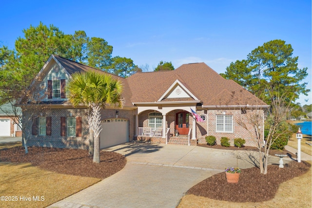 view of front of property featuring a garage and a porch