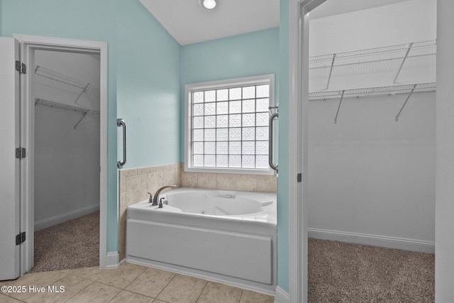 bathroom featuring a bathing tub and tile patterned flooring