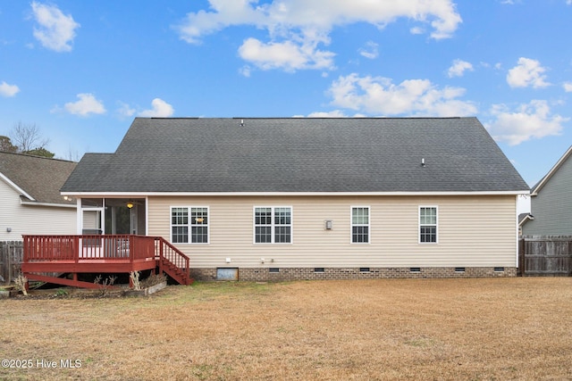 back of house with a deck and a lawn