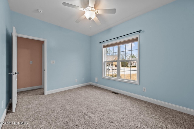 carpeted empty room with ceiling fan