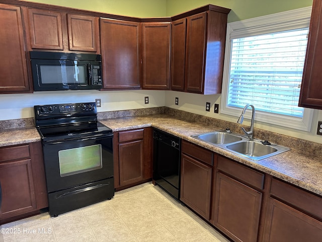 kitchen with sink and black appliances