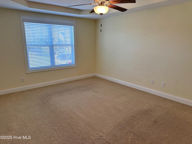 carpeted empty room with ceiling fan