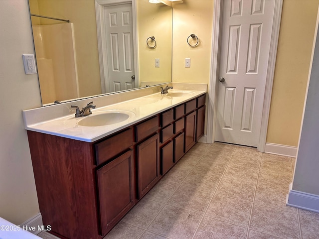 bathroom featuring tile patterned flooring and vanity