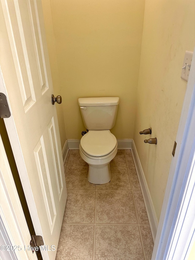 bathroom featuring tile patterned floors and toilet