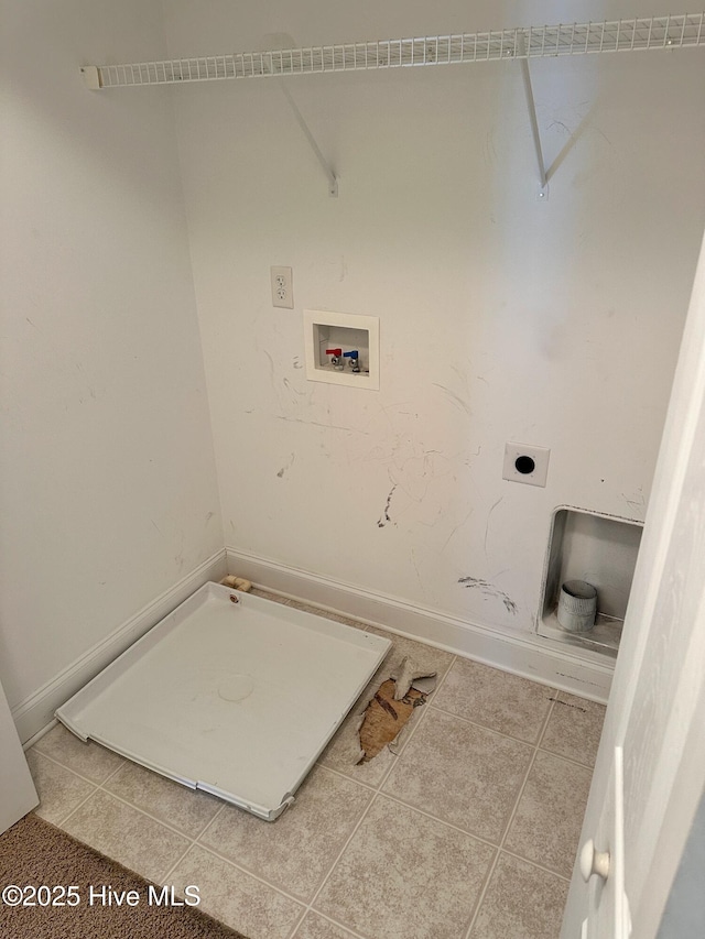 laundry area with hookup for an electric dryer, hookup for a washing machine, and tile patterned floors