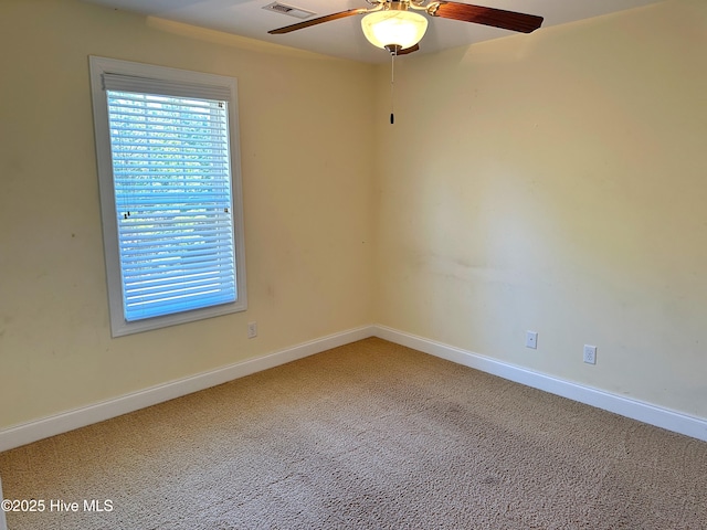 unfurnished room with carpet flooring and ceiling fan