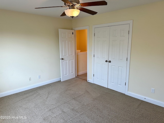 unfurnished bedroom featuring carpet floors, a closet, and ceiling fan