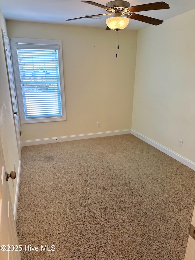 unfurnished room with carpet and ceiling fan