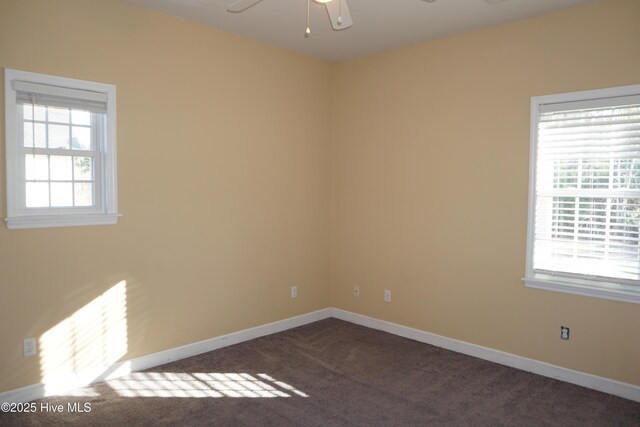 carpeted spare room with ceiling fan