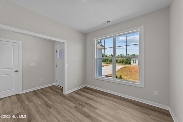 spare room featuring light hardwood / wood-style floors