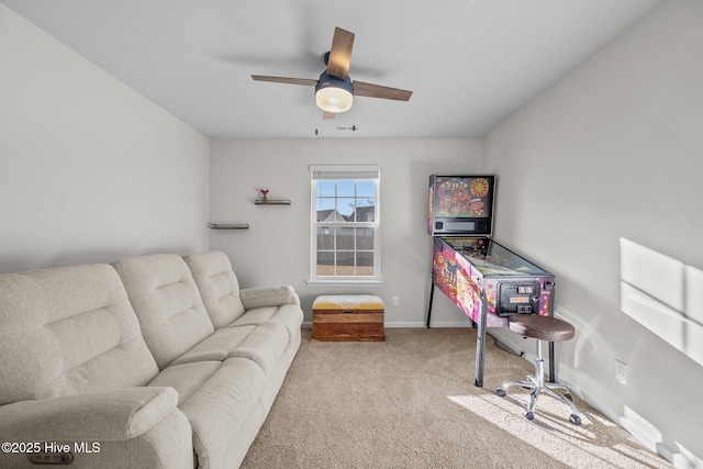 office space with ceiling fan and light colored carpet