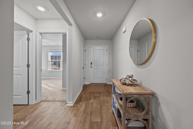 corridor featuring light hardwood / wood-style flooring