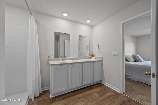 bathroom with hardwood / wood-style flooring and vanity