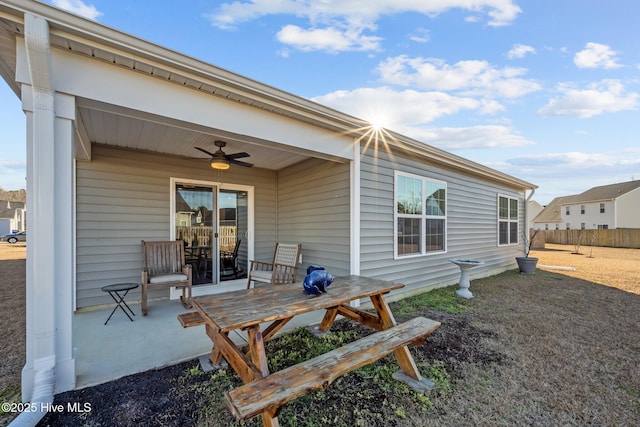 back of property featuring ceiling fan