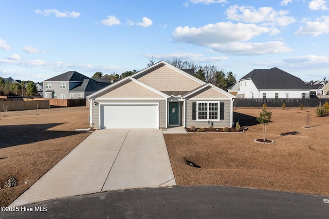 view of front facade with a garage and a front yard