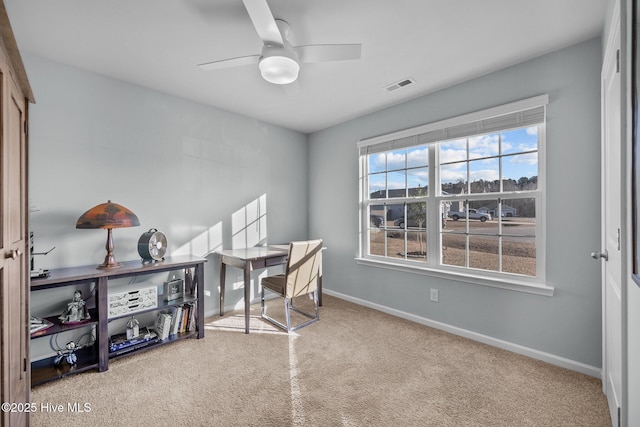 home office featuring ceiling fan and carpet floors