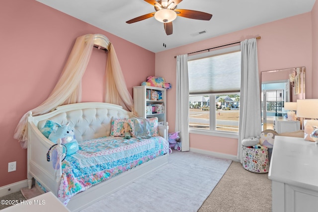 bedroom featuring light carpet and ceiling fan