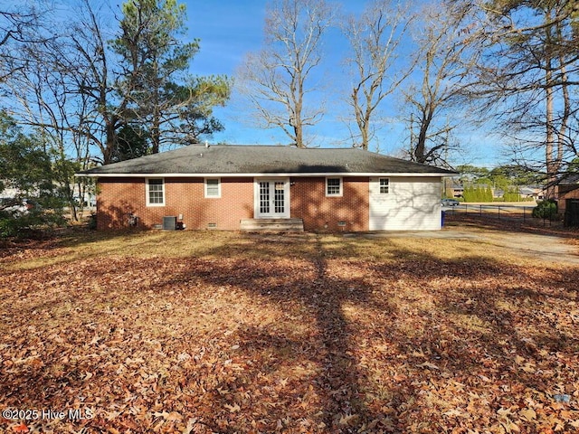 back of property featuring central AC unit and french doors