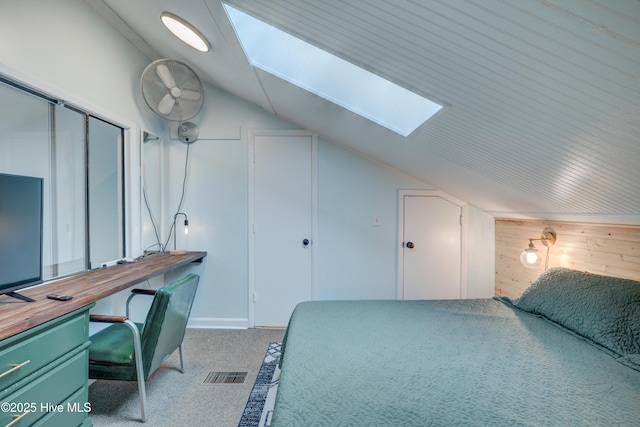 bedroom with wood walls and vaulted ceiling