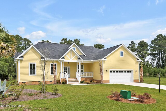 craftsman-style home featuring crawl space, driveway, a shingled roof, covered porch, and a front yard