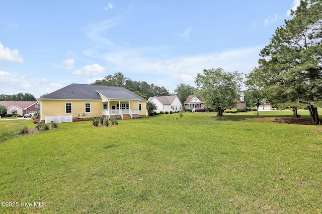 view of yard with covered porch