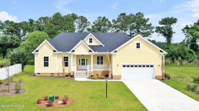 craftsman-style home with fence, a front lawn, crawl space, driveway, and a porch