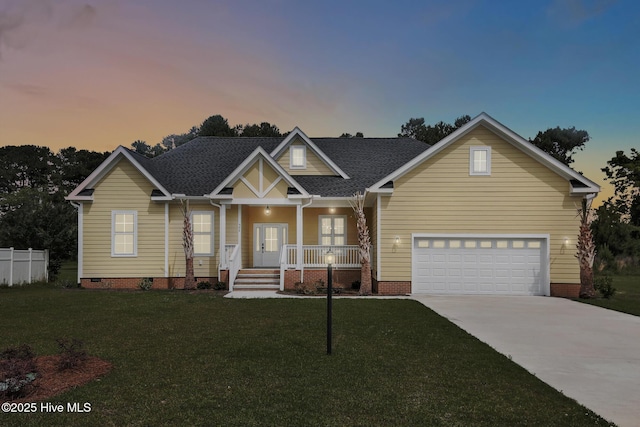 view of front of home with a lawn and a porch