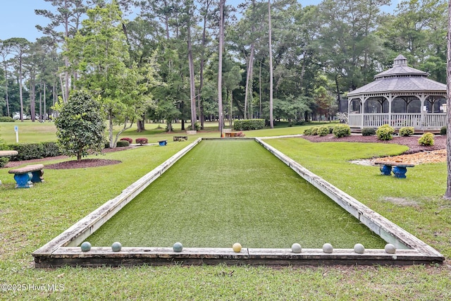 view of property's community with a lawn and a gazebo