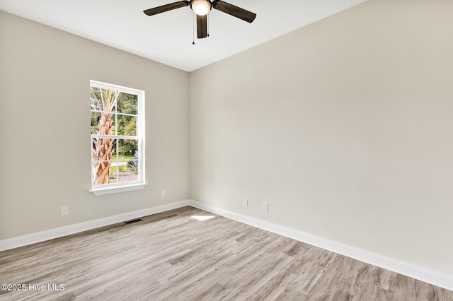 unfurnished room with ceiling fan and light hardwood / wood-style flooring