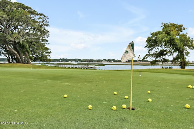 view of property's community with view of golf course and a water view