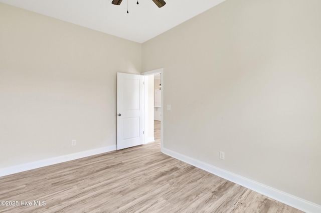 unfurnished room featuring ceiling fan, baseboards, and light wood-type flooring