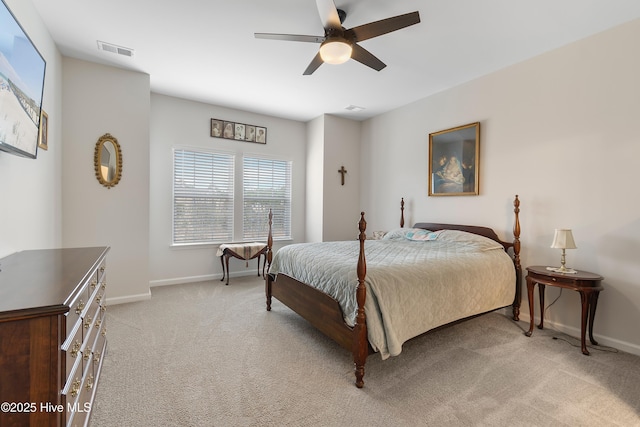 bedroom with ceiling fan and light carpet