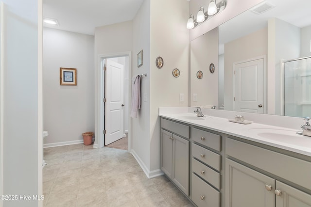 bathroom featuring vanity, toilet, and walk in shower