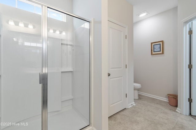 bathroom featuring toilet and walk in shower